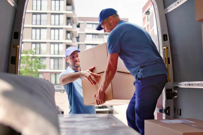 Two movers unloading cargo. What steps to take after an accident with a Penske truck.