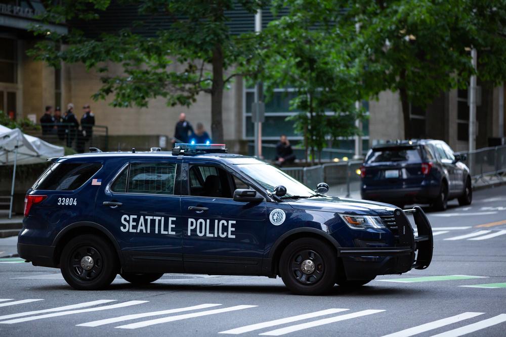 The skyline in Seattle, WA, where you can get a car crash report by contacting the local authorities.