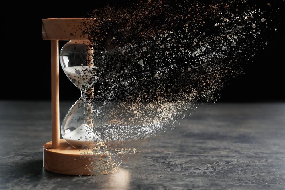 An hourglass partially dissolving to represent the statute of limitations in Washington.