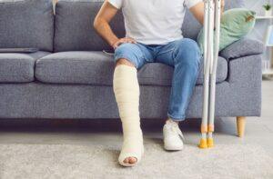 A man with his leg in a cast wondering about pure comparative negligence in Washington State.