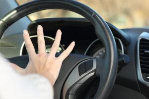 A teen driver honking the horn to avoid an accident during the 100 deadliest days of summer.