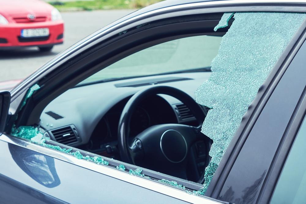 A smashed window of a car after a UPS truck accident. What is the average settlement?