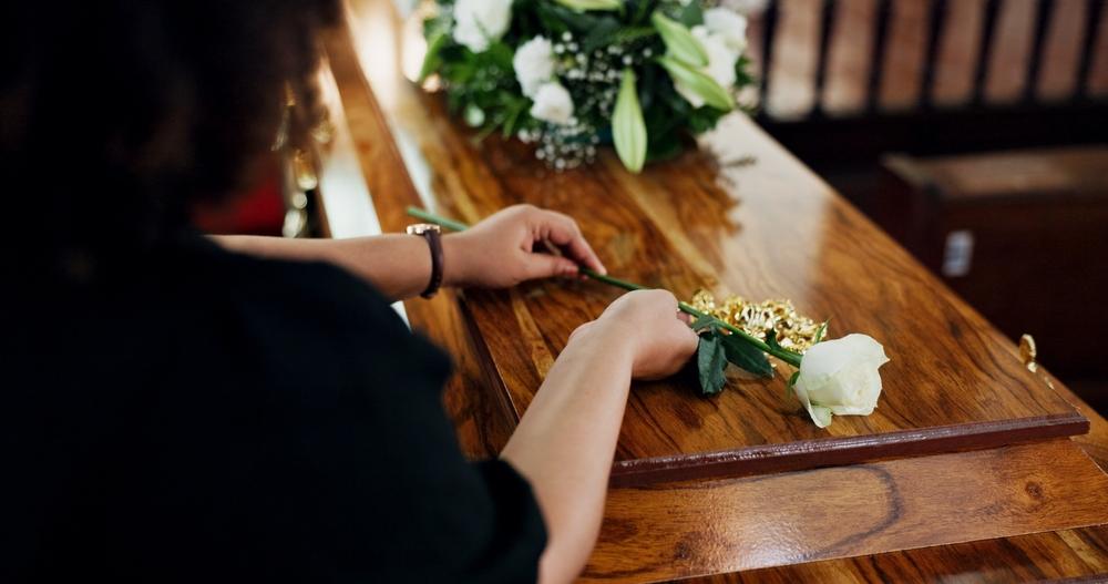 A flower on a casket at a funeral. What is the average settlement for a wrongful death?
